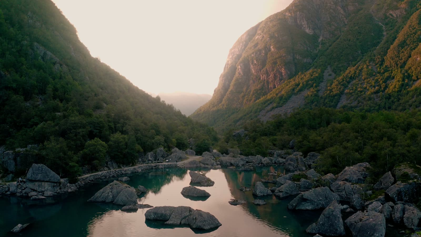 Mountain landscape filmed at sunset above a natural pool